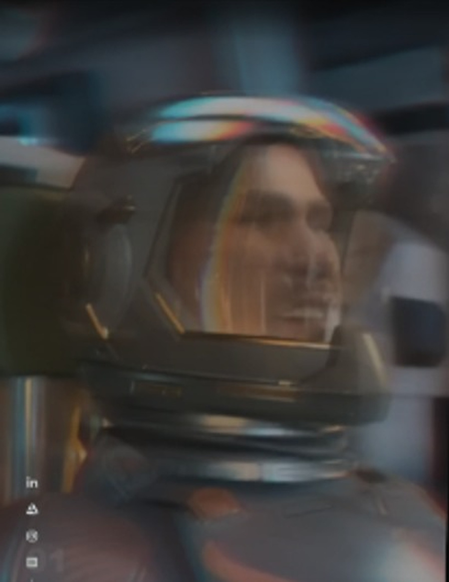 A performer seen through reflective cinematic equipment